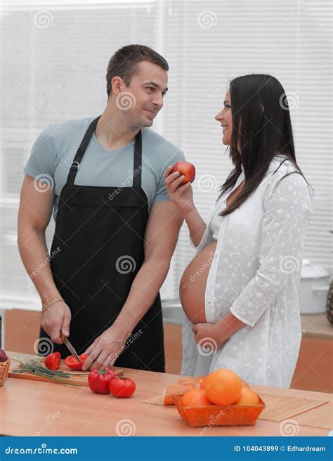 Pregnant Woman With Husband Cooking Food In Kitchen Stock Image Image Of Cooking Household