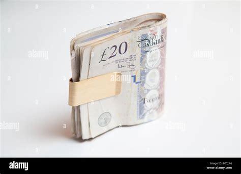 A Pile Of Used Uk Sterling Cash £20 And £10 Notes Stock Photo Alamy