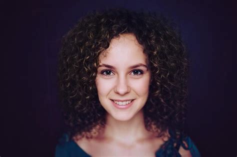 Premium Photo Beautiful Curly Haired Girl Posing For The Camera