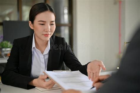 Beautiful Asian Female Lawyer Or Business Law Consultant Having A