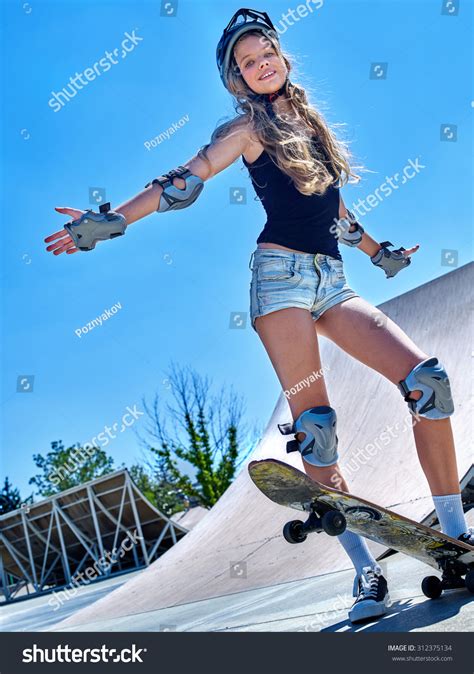 Teen Skateboarding His Skateboard Outdoor Girl Do Stunt Stock Photo