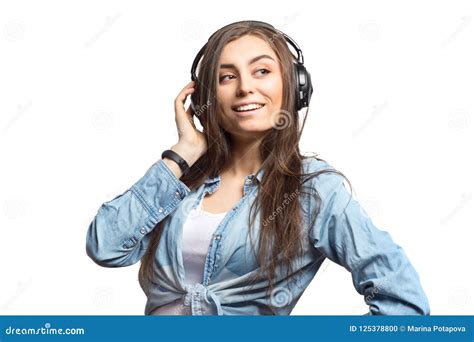 Portrait Of A Young Brunette Woman Listening To The Music With