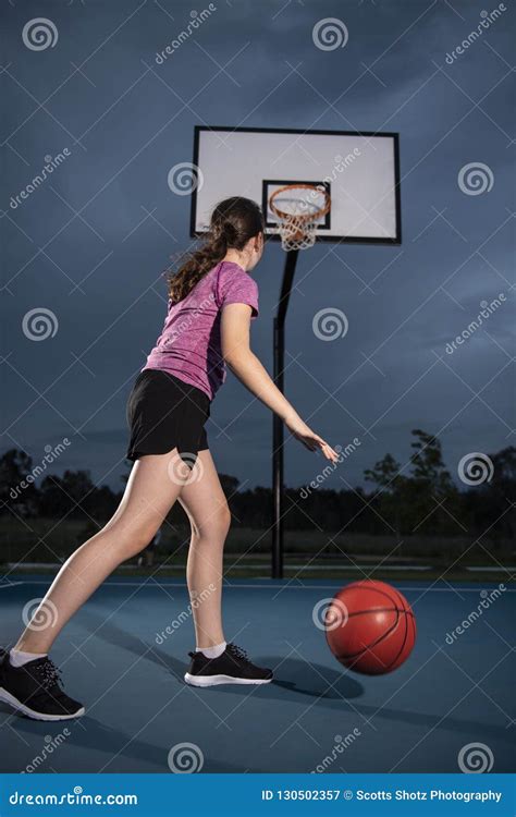 Girl Dribbling A Basketball At An Outdoor Court Stock Image Image Of