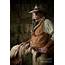 Old West Cowboy With Woolie Chaps And Pistols In Stable Photograph By 