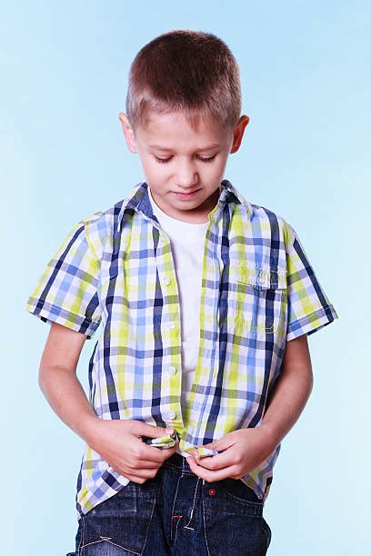 Child Buttoning Shirt Stock Photos Pictures And Royalty Free Images Istock