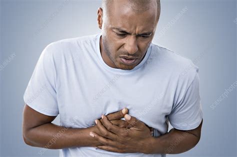 Man Clutching His Chest In Pain Stock Image F026 5215 Science Photo Library