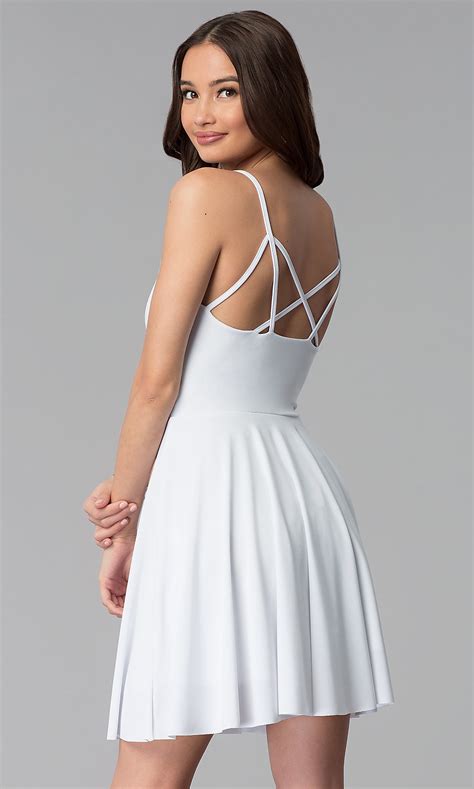 This sounds too casual for graduation but because of the material and cut, it looks super chic. V-Neck Short Caged-Back White Graduation Dress