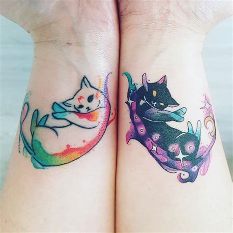 Matching cat tattoos