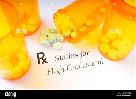 Prescription Drug Bottles And Statin Pills Used For High Cholesterol On