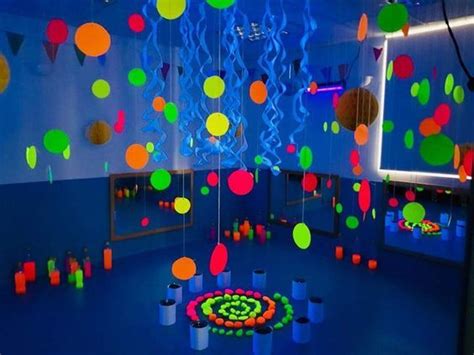 A Room Filled With Lots Of Different Colored Balls And Streamers