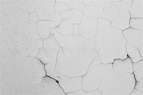 Cracked Flaking White Paint On The Wall Background Texture Stock Image