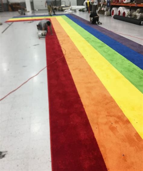 Geometric rugs feature bold shapes, colors, and patterns—from diamonds to stripes to zigzag—adding visual interest to your modern home decor. Rainbow Aisle Runner | Custom L-Shape Runner from Event Rugs