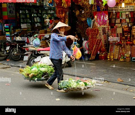 Street Traders And Hawkers Selling Hats Fruit Vegetables Cleaning