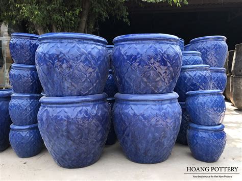 A Set Of 3 Shiny Navy Blue Glazed Ceramic Planters With Thick Rims And