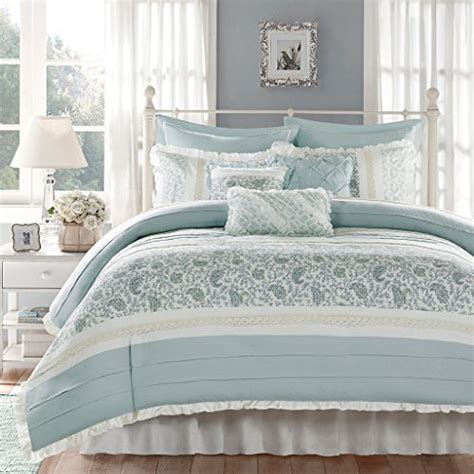 This comforter set features piped edges and an elegant box stitch to prevent fill from shifting. Light Blue and White Comforters and Bedding Sets