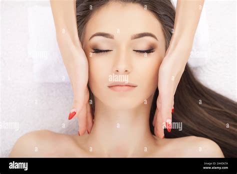 Body Care Face Massage Beautiful Young Woman Relaxing With Hand Massage At Beauty Spa Salon