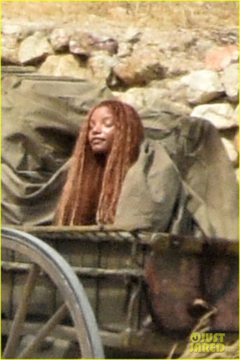 check out halle bailey in ariel s iconic burlap outfit in these little mermaid set photos