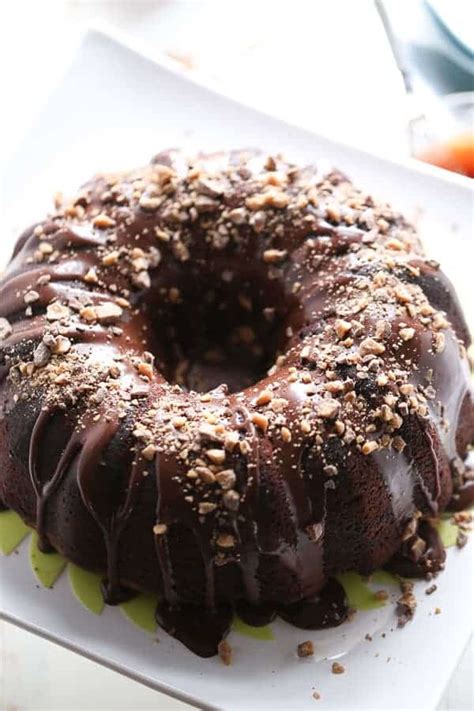 Lemon bundt cake with chocolate glaze and candied lemon. Guinness Chocolate Bundt Cake - LemonsforLulu.com