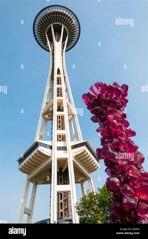 The Seattle Space Needle Next To An Exhibit From Chihuly Garden And Glass In The Seattle Center