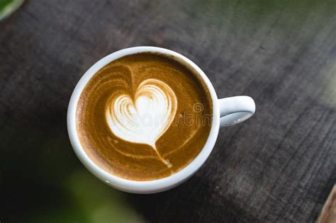 Heart Shaped Coffee Latte On Wooden Table Stock Photo Image Of Heart