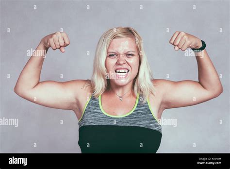 Female Bodybuilder Flexing Biceps High Resolution Stock Photography And