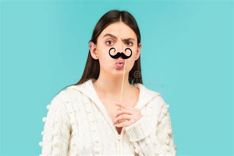 Surprised Winking Model Girl Holding Funny Mustache On Stick And