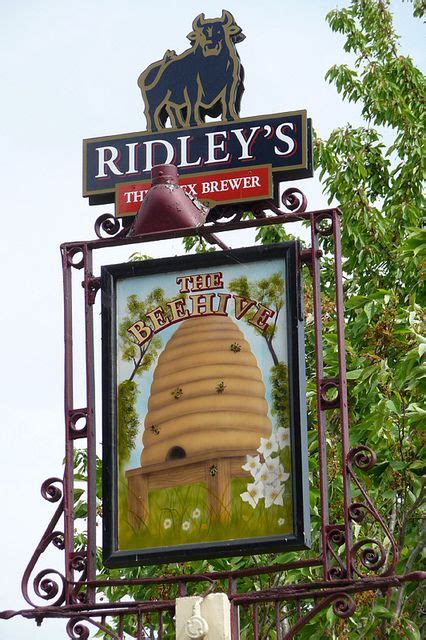 The Sign For Ridleys Is Attached To An Old Metal Frame With A Bear On It