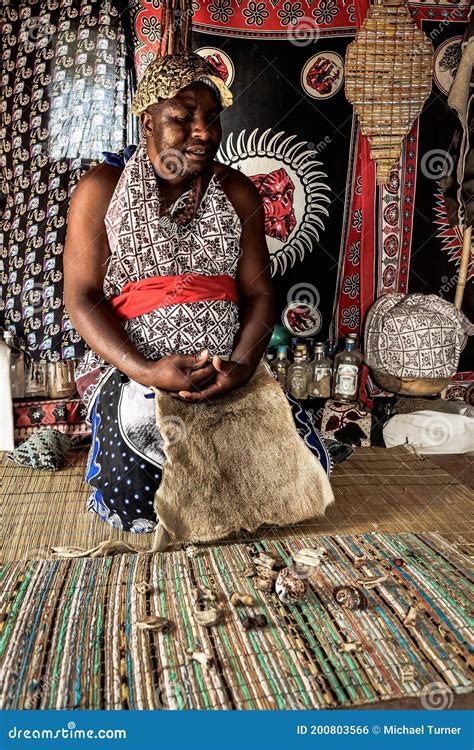 Traditional Healer Known As A Sangoma Or Witch Doctor Performing A Spiritual Reading With Bones