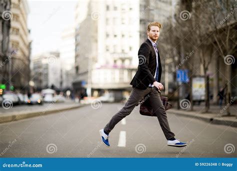 Young Man Walking On The Street Stock Photo Image Of Walking