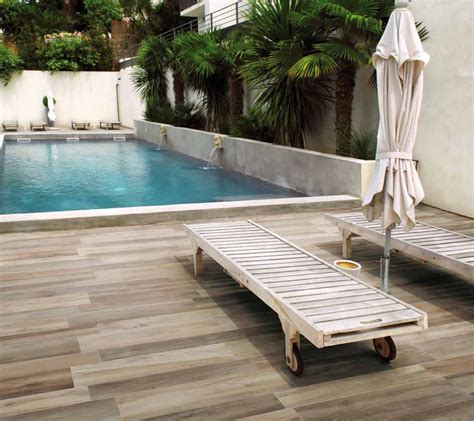 Inspiration for a small contemporary backyard tile outdoor patio shower remodel in san francisco with no cover tile applied to wall behind shower on deck. Outdoor pool patio with porcelain tile floors ...