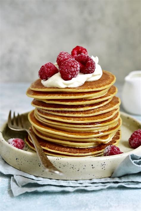 Stack Of Homemade Delicious Hot Pancakes With Honey Cream And