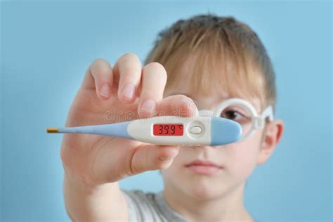 Woman With A Thermometer In His Hand Increased Body Temperature Stock