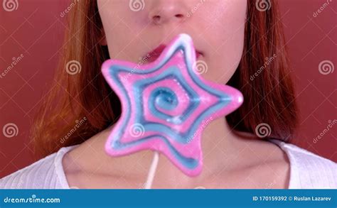 close up beautiful girl sucking star lollipop stock footage video of food hand 170159392