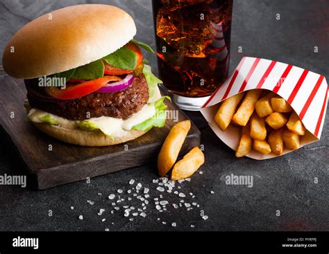 Fresh Beef Burger With Sauce And Vegetables And Glass Of Cola Soft