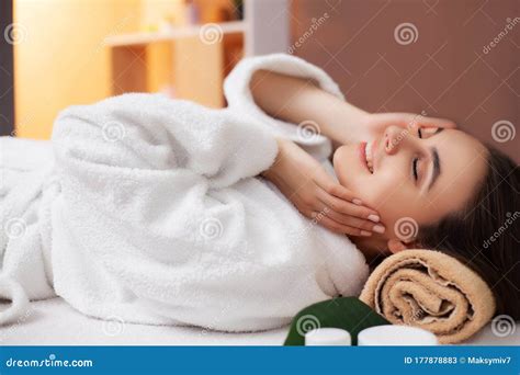 Pretty Woman Receiving A Relaxing Massage At The Spa Salon Stock Image