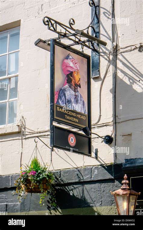 View Of A Traditional English Pub Sign Hanging Over The Saracens Head