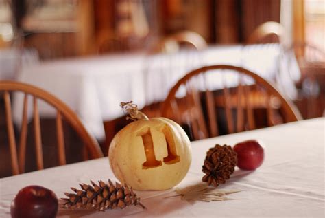 Fall Wedding Table Numbers Carved Into White Pumpkins As Centerpiece