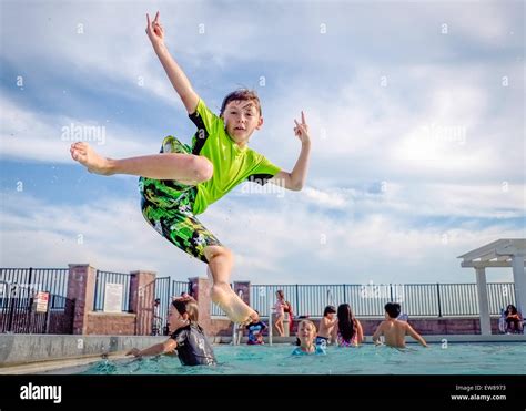 Young Boy Jumping Into The Poolhewlett Point Park East Rockaway Ny