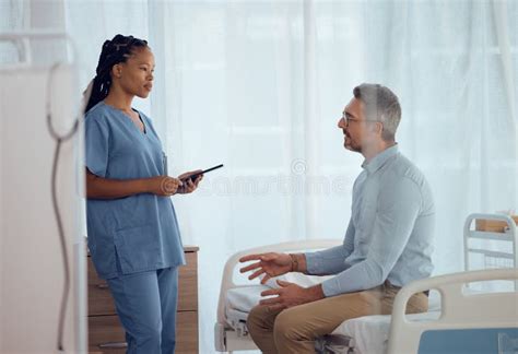 Man Talking Or Nurse In Consultation In Hospital Speaking Listening