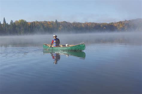 Canoeing On An Autumn Lake Stock Photo Image Of Exercise 45695542