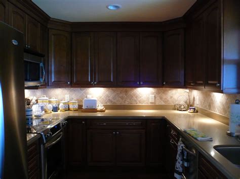 To begin the project, i i love how the new lighting really highlights the backsplash and gives the kitchen an inviting warm glow! Under Cabinet Lighting Options - DesignWalls.com