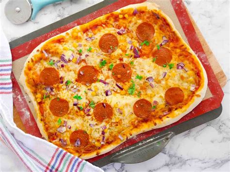 Prepare a lightly spinkled surface with flour. Thin Crust Pizza Dough Recipe in 2020 | Thin crust pizza ...