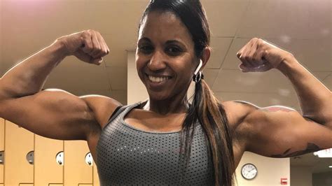 41 Years Young Muscle Woman Aymara Flexing Her Biceps