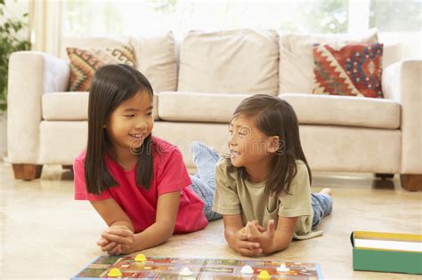 Two Children Playing Board Game At Home Stock Image Image Of Happy