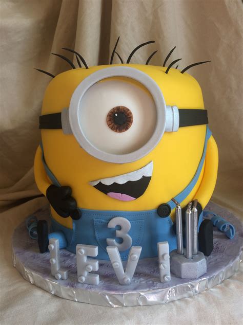 We did two chocolate layers and two yellow cake layers. Minion birthday cake | Minion birthday cake, Cake designs ...