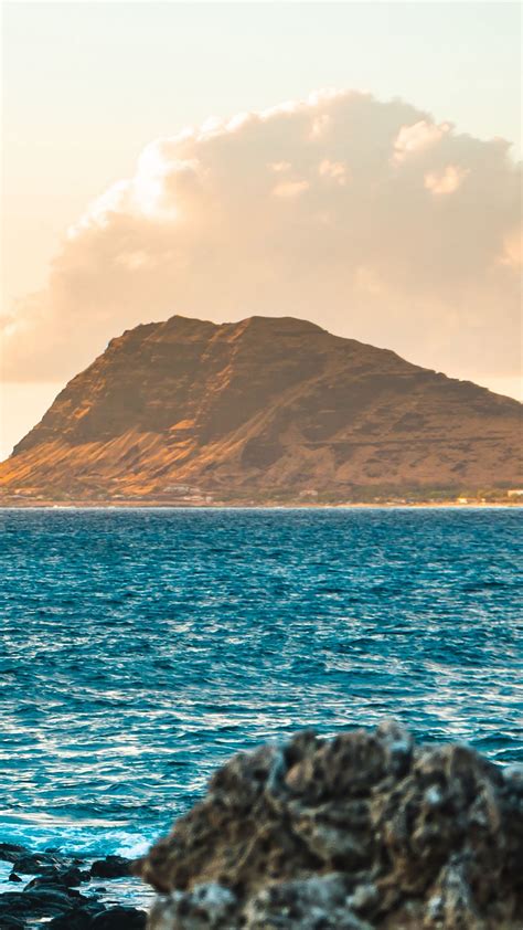 Brown Mountain In Front Of Blue Ocean During Daytime 4k Hd Nature