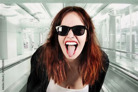 Young Beauty Hipster Woman Screaming And Showing Tongue Funny Face