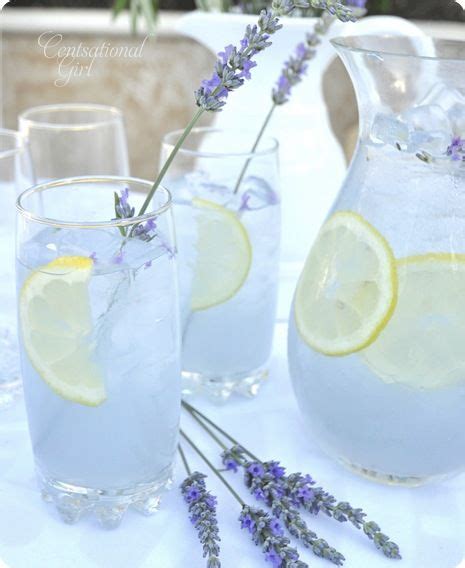 Lavender Water And Lemonade Are Served In Pitchers On A White