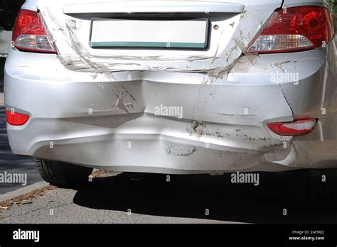 Close Up Wrecked Rear Bumper And Tail Lights Of New Modern Grey Car