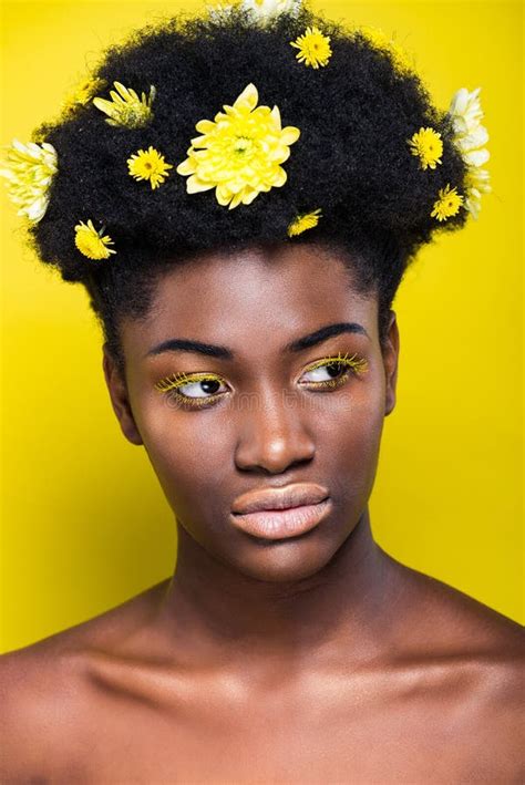 African American Girl With Flowers In Hair Looking Away On Yellow Stock Photo Image Of Nude